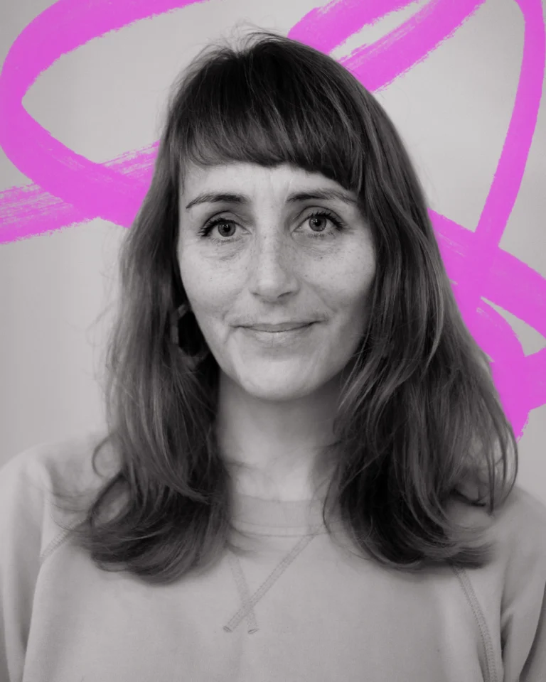 a closeup black and white portrait of a woman with long dark straight hair. Behind her is a hand-drawn scribble in neon pink.
